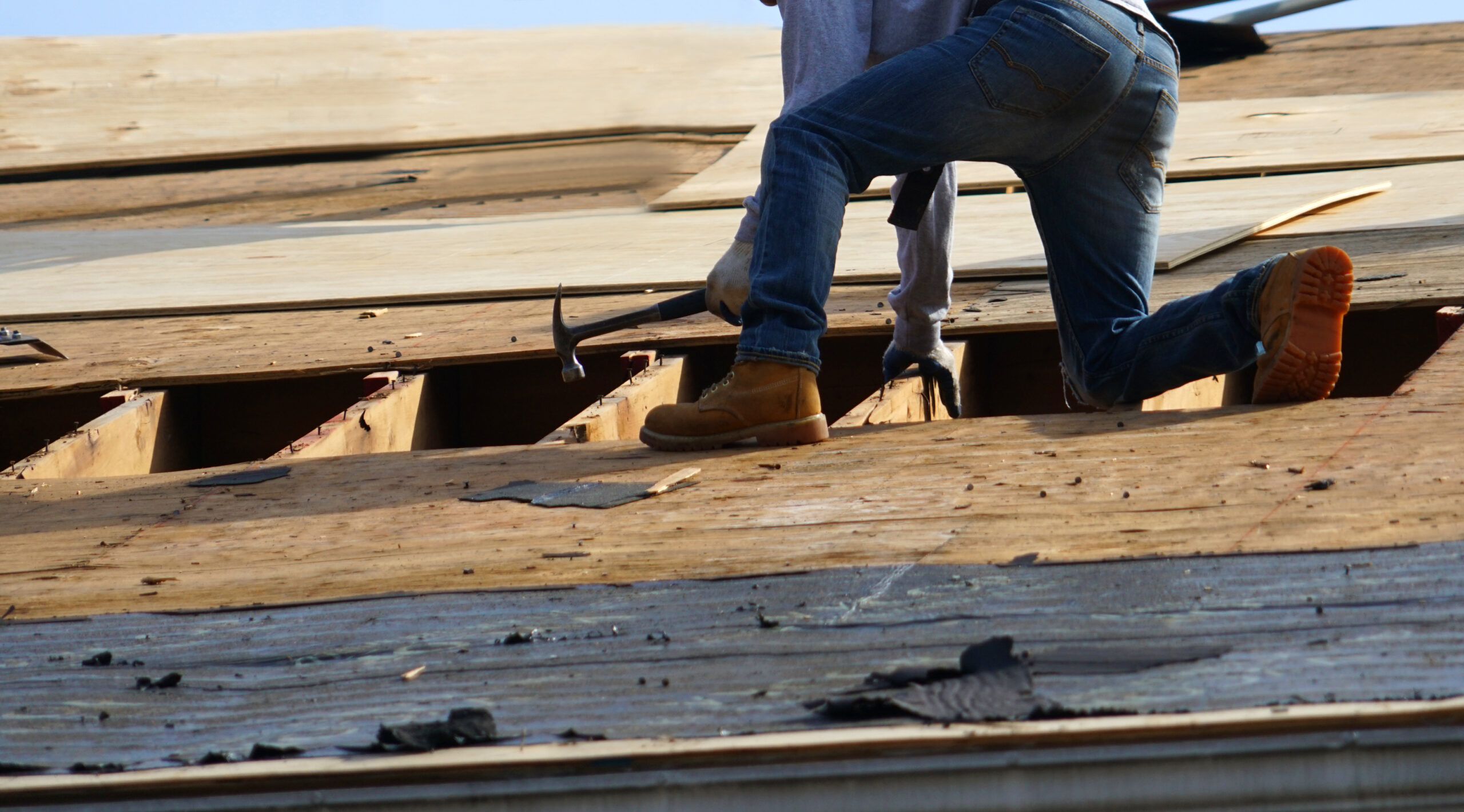 Handyman working on repairing the roof