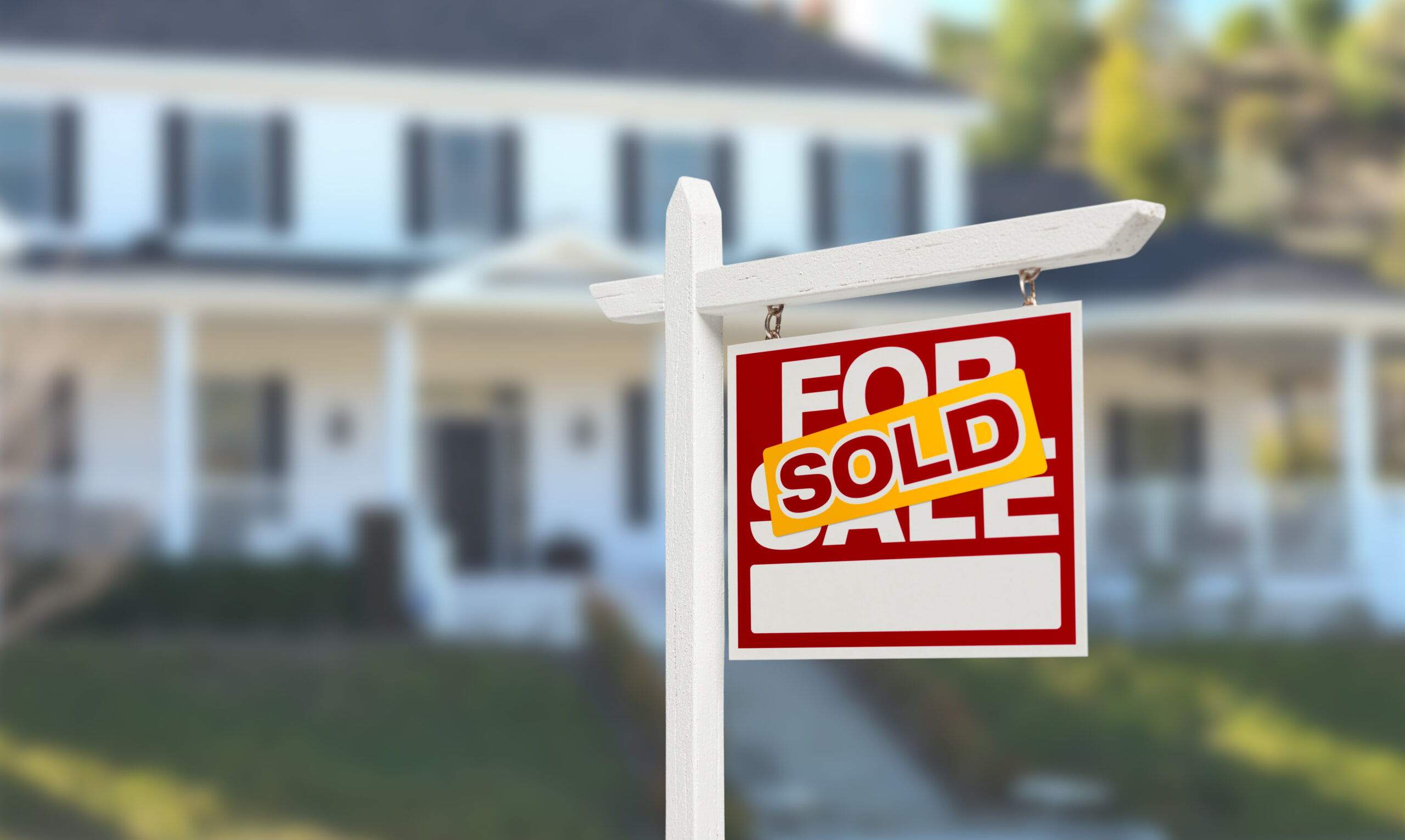 Sold Home For Sale Real Estate Sign in Front of Beautiful House